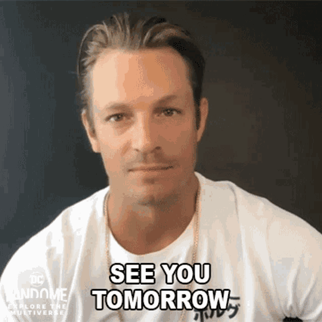 a man wearing a white shirt says " see you tomorrow " in front of a black background