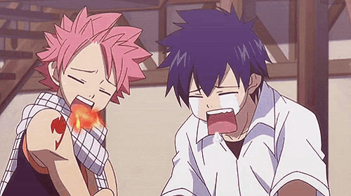 a couple of anime characters are standing next to each other and one of them has a tattoo on his arm that says fairy tail