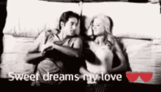 a man and a woman are laying on a bed with the words `` sweet dreams my love '' above them .