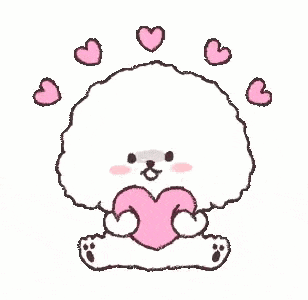 a fluffy dog is holding a pink heart in its paws .
