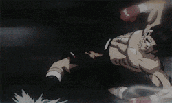 two men are fighting in a boxing ring and one of them is falling .