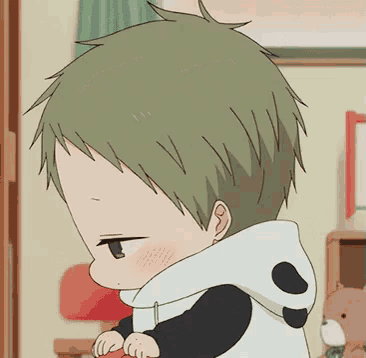 a little boy with green hair and a panda hoodie