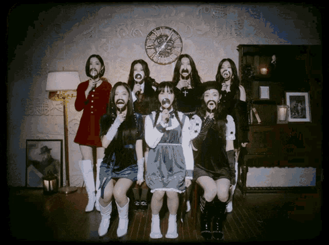 a group of girls are posing for a photo with their mouths open