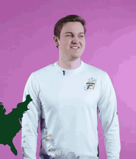 a man wearing a long sleeve shirt with the letter f on the front