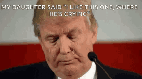donald trump is crying while giving a speech in front of a microphone with tears coming out of his eyes .