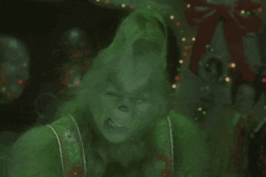 a picture of a grinch with the words an " award " of some kind above him