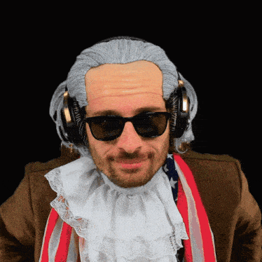 a man wearing a wig and sunglasses has headphones on