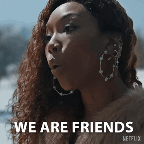 a woman wearing hoop earrings and a fur coat says we are friends