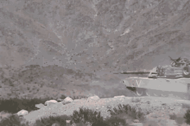 a tank with the letter v on the side is firing a rocket
