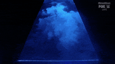 a silhouette of a wrestler flexing his muscles in front of a blue background
