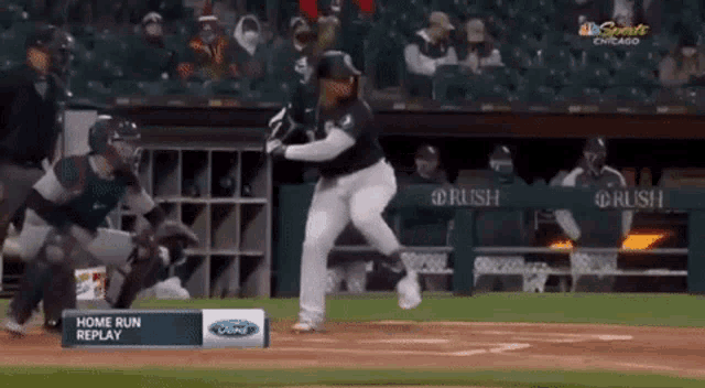 a baseball game is being played in chicago and the home run replay is being shown on tv