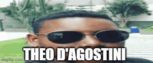 a man wearing sunglasses with the name theo d' agostini on the bottom