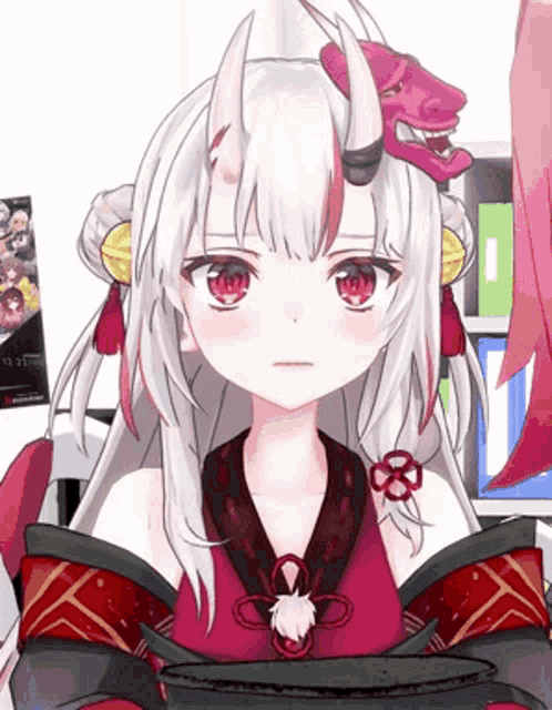 a girl with white hair and red eyes is wearing a red kimono and a red mask .