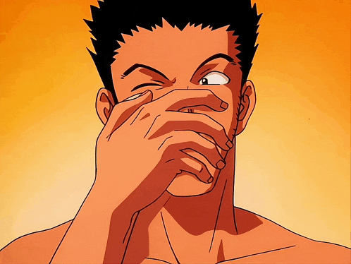 a man covering his face with his hand and making a face