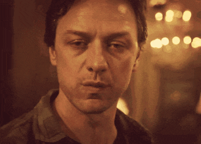 a close up of a man 's face with his mouth open