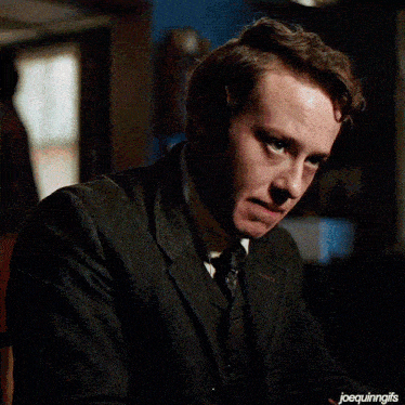 a close up of a man 's face with joequinngifs written below it