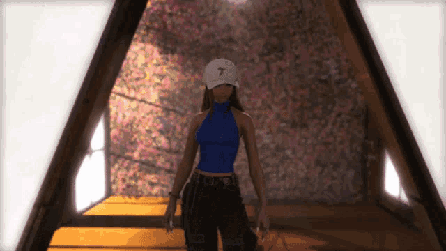 a woman wearing a blue top and a white hat with a 7 on it