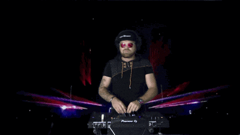 a man wearing headphones and sunglasses is playing music on a pioneer dj turntable