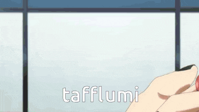 a man and a woman are standing next to each other and the word tafflumi is on the bottom right