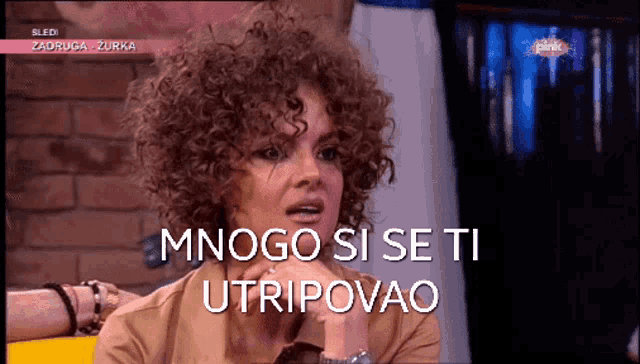 a woman with curly hair says mnogo si se ti utripovao