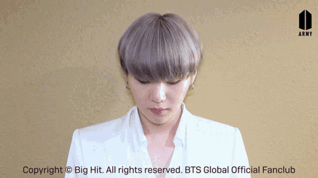 a picture of a person with gray hair and the words copyright big hit all rights reserved bts global official fanclub on the bottom