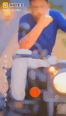 a man is riding a motorcycle with the words royal & loyal written on the screen