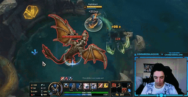 a man is playing a video game with a dragon on the screen with the number 341