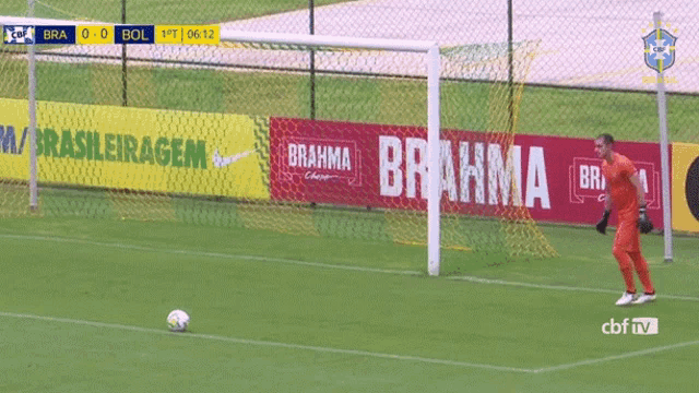 a soccer game is being played in front of a brahma banner