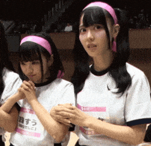 a girl wearing a pink headband has a name tag that says ' a ' on it