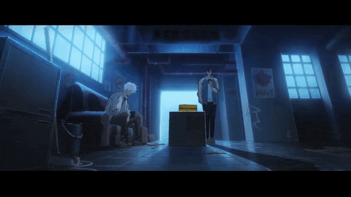 a man sits on a couch in a dark room with a sign that says eraser on it