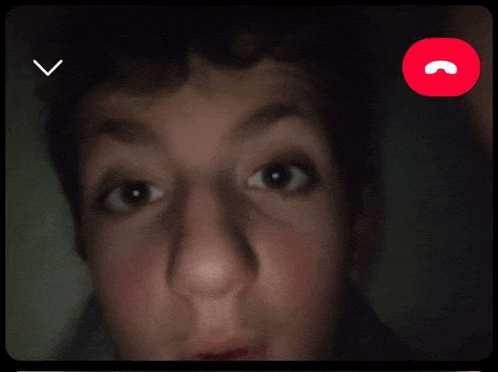 a close up of a person 's face with a red phone icon