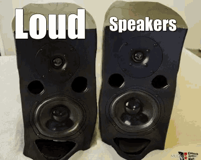 a pair of speakers sitting next to each other with the words " loud speakers " on the bottom