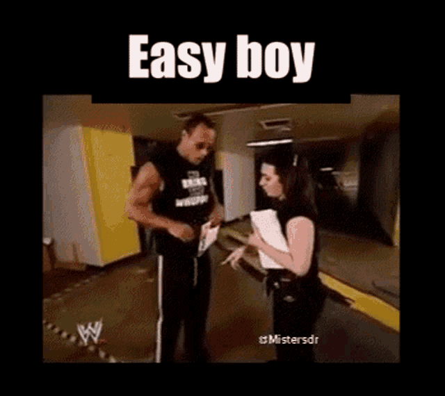 a man and a woman are standing next to each other and the words easy boy are above them