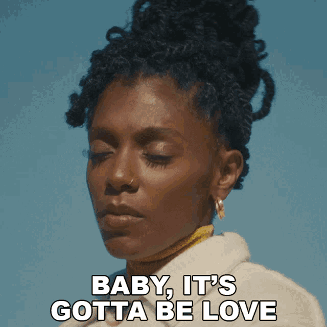 a close up of a woman with the words baby it 's gotta be love above her