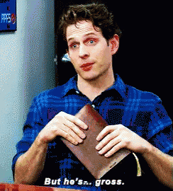 a man in a blue plaid shirt is holding an empty wallet and saying but he 's gross