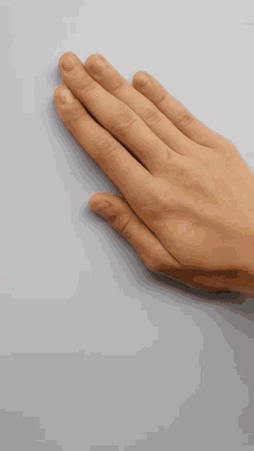 a close up of a person 's hand with the words ok written below it