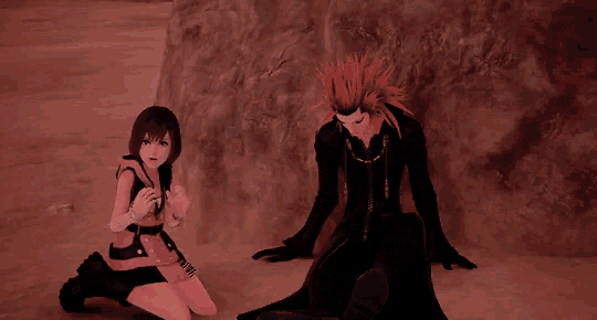 a man with red hair is holding a girl in his arms