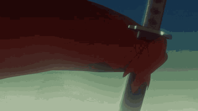 a red cloth is draped over a sword