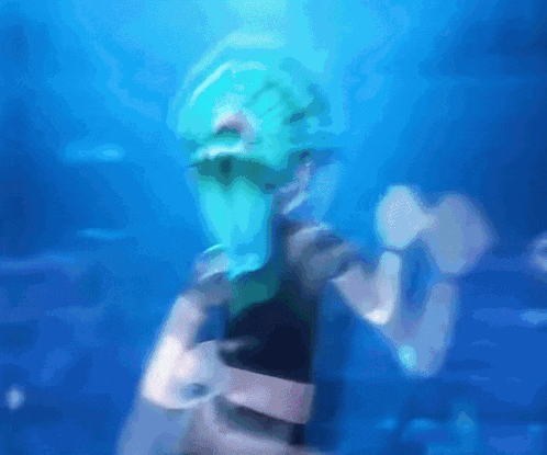 a blurry picture of a person wearing a blue mask in the water