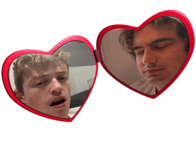 two red heart shaped mirrors with a man 's face on them