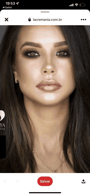 a woman 's face is displayed on a phone screen with the website lacremania.com.br at the bottom