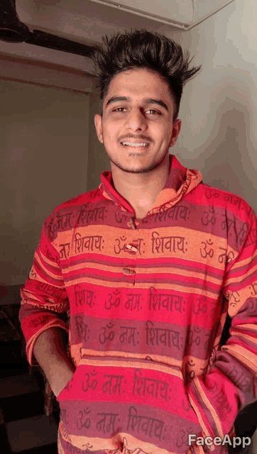 a young man wearing a red and orange striped shirt that says faceapp on it