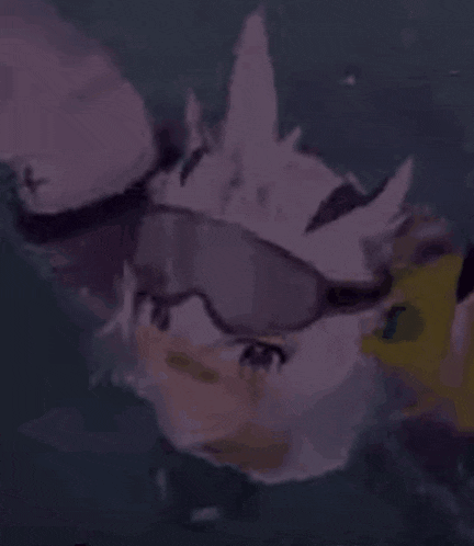 a cartoon character is wearing goggles and swimming in the ocean .