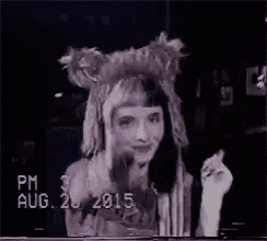 a woman in a bunny costume is dancing on a stage in a video tape .
