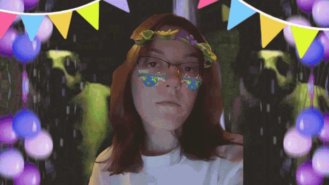 a girl with glasses and a flower crown on her head is surrounded by balloons