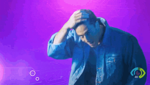 a man in a blue jacket is scratching his head against a purple background
