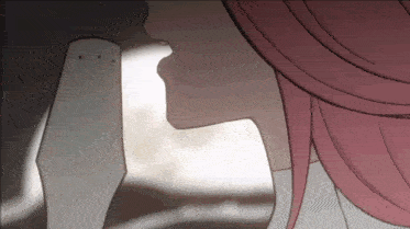 a close up of a woman 's face with pink hair looking down