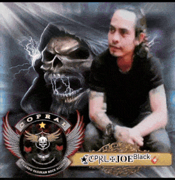 a man in a black shirt is sitting in front of a skull and a cprl logo