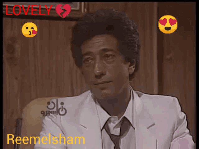 a man in a white suit and tie with the name reemelsham on the bottom right corner