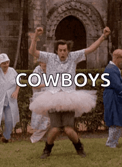 a man in a tutu is dancing in front of a group of cowboys